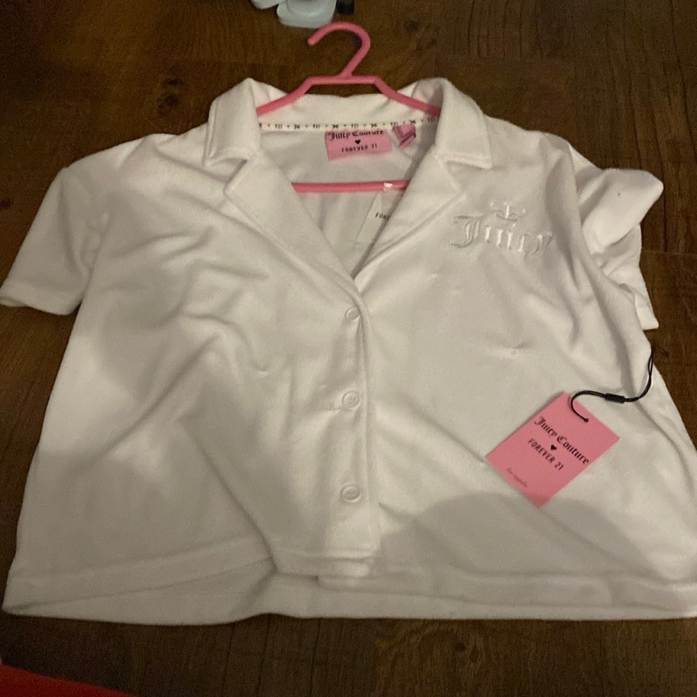 It’s a juicy couture, white large shirt button up